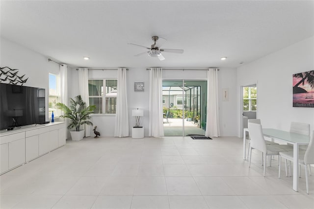 8802 SW 79th Loop, Ocala, FL 34481 - unfurnished living room with ceiling fan, healthy amount of natural light, light tile patterned flooring, and recessed lighting