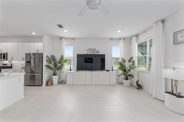 8802 SW 79th Loop, Ocala, FL 34481 - living area featuring healthy amount of natural light, a ceiling fan, and recessed lighting