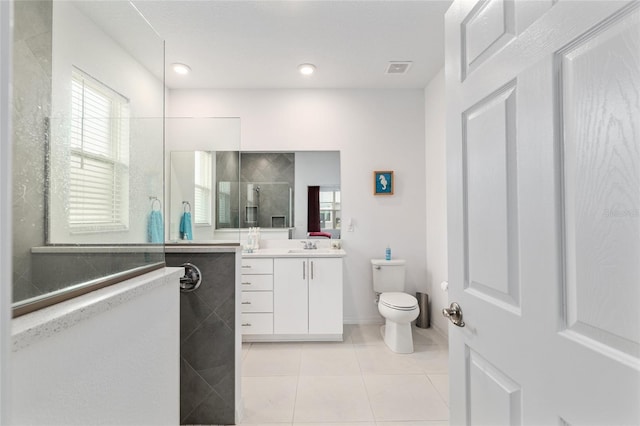 8802 SW 79th Loop, Ocala, FL 34481 - full bathroom featuring vanity, walk in shower, toilet, and tile patterned flooring