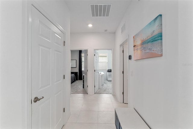 8802 SW 79th Loop, Ocala, FL 34481 - hall featuring light colored carpet, light tile patterned floors, and recessed lighting