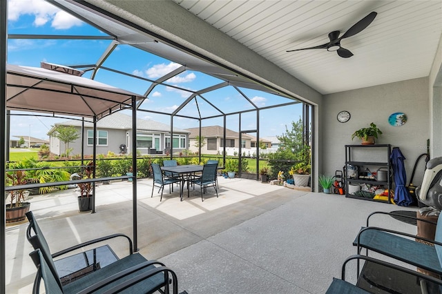 8802 SW 79th Loop, Ocala, FL 34481 - view of patio featuring outdoor dining space, a residential view, a ceiling fan, and glass enclosure