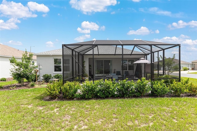 8802 SW 79th Loop, Ocala, FL 34481 - back of property with a lawn, stucco siding, and a lanai