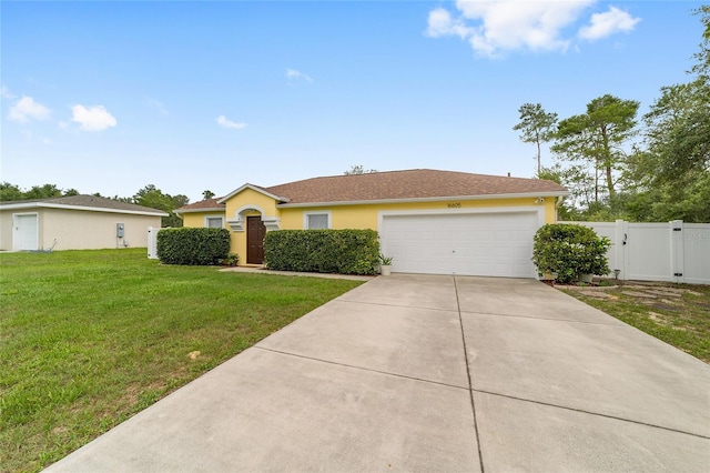 16605 SW 31st Cir, Ocala, FL 34473 - view of front facade featuring an attached garage, concrete driveway, a gate, and stucco siding