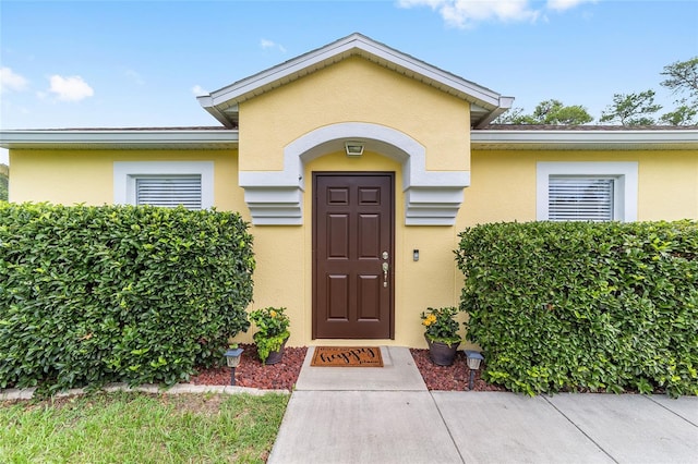 16605 SW 31st Cir, Ocala, FL 34473 - view of exterior entry featuring stucco siding