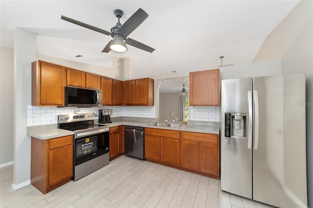16605 SW 31st Cir, Ocala, FL 34473 - kitchen with stainless steel appliances, backsplash, ceiling fan, light countertops, and brown cabinetry
