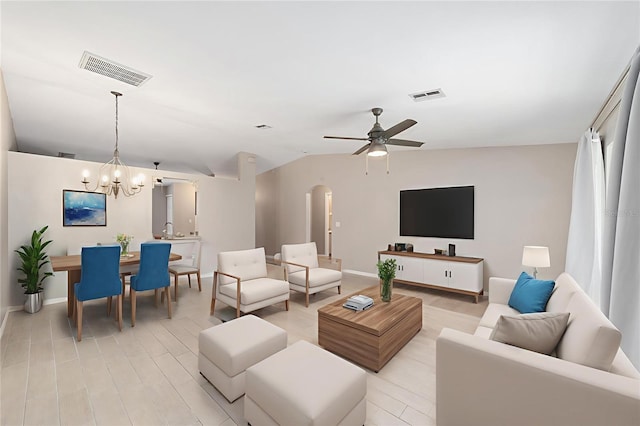 16605 SW 31st Cir, Ocala, FL 34473 - living area featuring arched walkways, a chandelier, a ceiling fan, lofted ceiling, and light wood finished floors