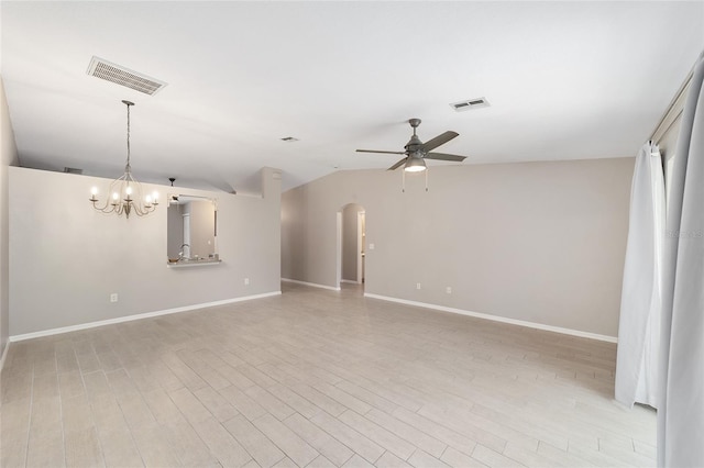 16605 SW 31st Cir, Ocala, FL 34473 - spare room featuring ceiling fan, a chandelier, arched walkways, light wood-style flooring, and vaulted ceiling