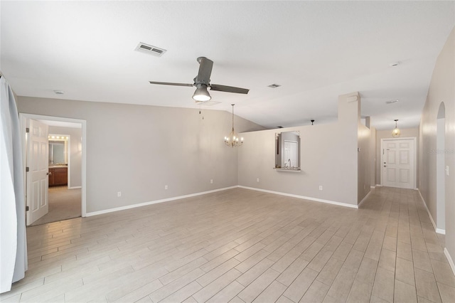 16605 SW 31st Cir, Ocala, FL 34473 - empty room featuring a ceiling fan, light wood-style floors, a chandelier, and vaulted ceiling