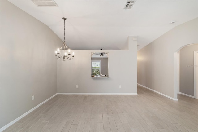 16605 SW 31st Cir, Ocala, FL 34473 - unfurnished room featuring arched walkways, light wood-type flooring, lofted ceiling, ceiling fan, and a chandelier
