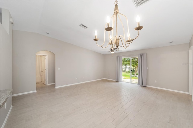 16605 SW 31st Cir, Ocala, FL 34473 - spare room with a chandelier, arched walkways, light wood-style floors, and lofted ceiling