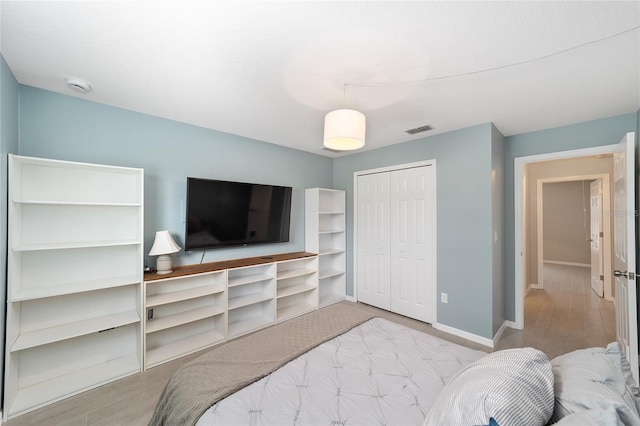 16605 SW 31st Cir, Ocala, FL 34473 - bedroom featuring a closet and wood finished floors