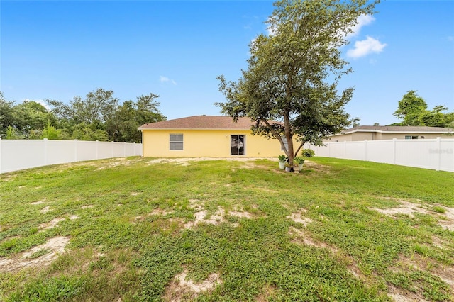 16605 SW 31st Cir, Ocala, FL 34473 - back of house with stucco siding and a fenced backyard