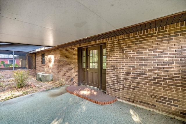 6497 W Anthony Rd, Ocala, FL 34479 - view of exterior entry featuring brick siding