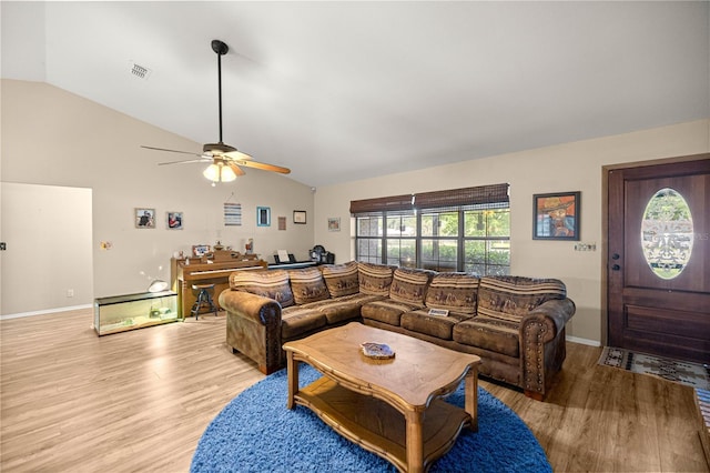 6497 W Anthony Rd, Ocala, FL 34479 - living room with lofted ceiling, a ceiling fan, light wood-type flooring, and plenty of natural light