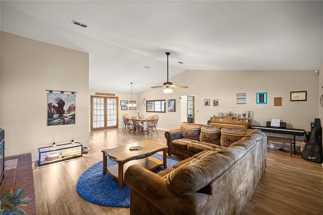 6497 W Anthony Rd, Ocala, FL 34479 - living room featuring wood finished floors, lofted ceiling, and a ceiling fan
