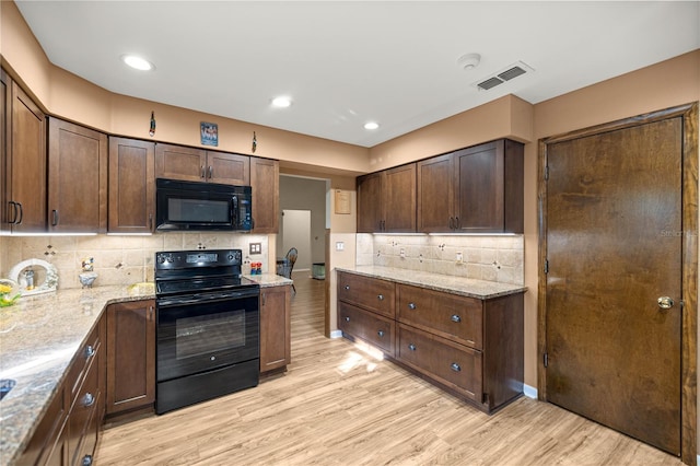 6497 W Anthony Rd, Ocala, FL 34479 - kitchen with black appliances, light wood finished floors, decorative backsplash, dark brown cabinets, and recessed lighting