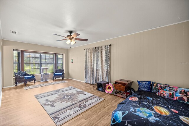 6497 W Anthony Rd, Ocala, FL 34479 - bedroom with wood finished floors and a ceiling fan