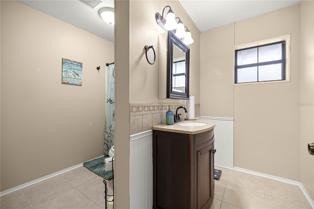 6497 W Anthony Rd, Ocala, FL 34479 - full bathroom featuring vanity, tile patterned flooring, toilet, and baseboards