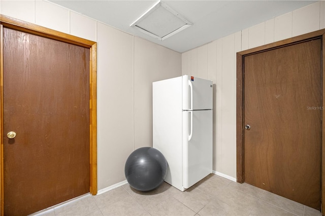 6497 W Anthony Rd, Ocala, FL 34479 - workout area with attic access and light tile patterned floors