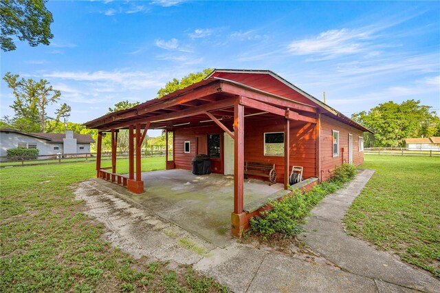 6497 W Anthony Rd, Ocala, FL 34479 - view of patio / terrace featuring a carport