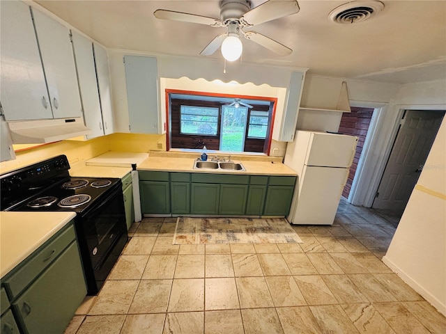 1051 SE 28th Rd, Ocala, FL 34471 - kitchen with green cabinets, freestanding refrigerator, black electric range oven, under cabinet range hood, and a sink