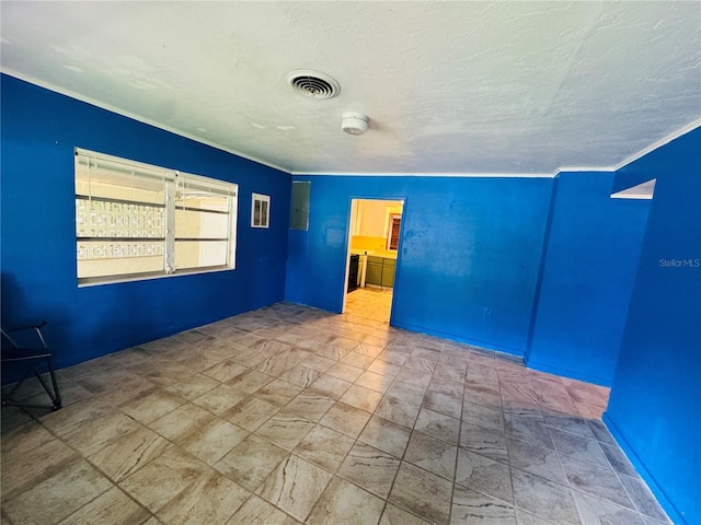 1051 SE 28th Rd, Ocala, FL 34471 - spare room featuring a textured ceiling and crown molding