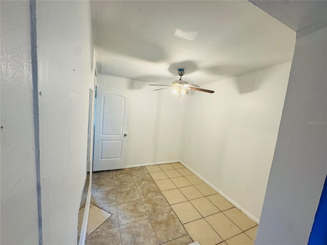 1051 SE 28th Rd, Ocala, FL 34471 - empty room featuring ceiling fan, light tile patterned floors, and baseboards