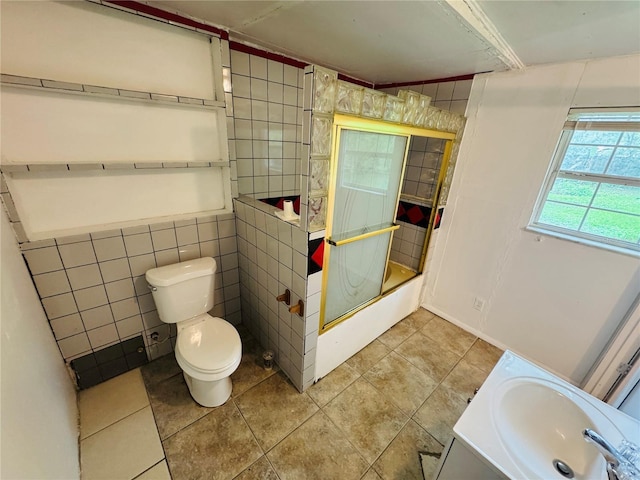 1051 SE 28th Rd, Ocala, FL 34471 - bathroom with toilet, a sink, tile walls, tile patterned flooring, and a shower