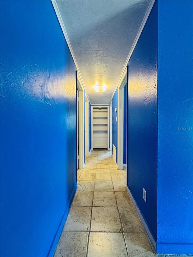 1051 SE 28th Rd, Ocala, FL 34471 - hallway with baseboards and a textured ceiling