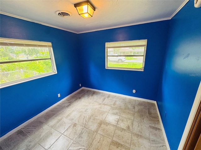 1051 SE 28th Rd, Ocala, FL 34471 - spare room with baseboards, ornamental molding, and stone finish floors