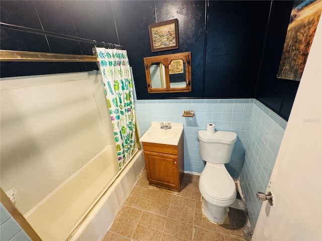 1051 SE 28th Rd, Ocala, FL 34471 - bathroom featuring toilet, shower / bath combo, tile patterned flooring, a wainscoted wall, and vanity