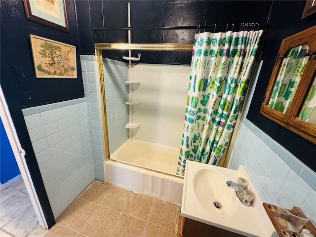 1051 SE 28th Rd, Ocala, FL 34471 - full bath featuring tile walls, shower / bath combo with shower curtain, vanity, tile patterned flooring, and wainscoting