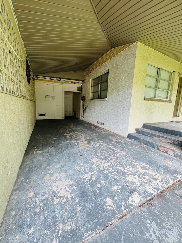 1051 SE 28th Rd, Ocala, FL 34471 - view of patio featuring an attached carport