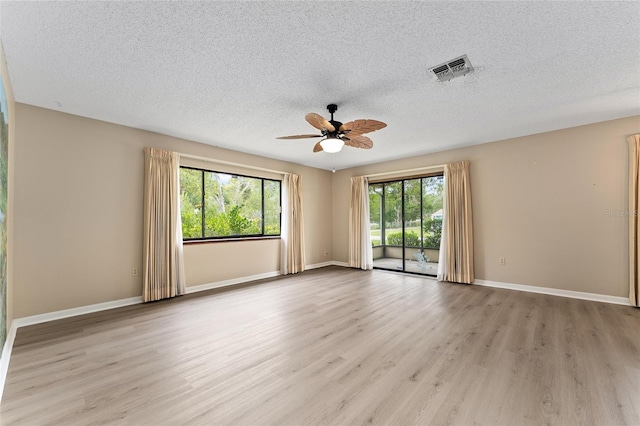 10012 SW 88th Ct, Ocala, FL 34481 - spare room with ceiling fan, light wood-type flooring, a textured ceiling, and baseboards
