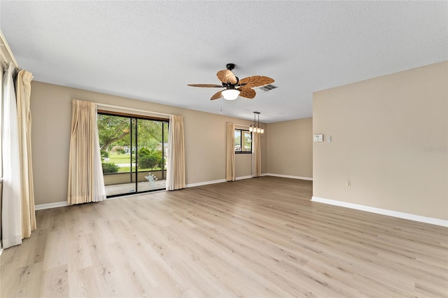 10012 SW 88th Ct, Ocala, FL 34481 - unfurnished room featuring ceiling fan, light wood finished floors, baseboards, and a textured ceiling
