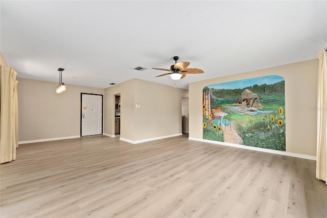 10012 SW 88th Ct, Ocala, FL 34481 - empty room featuring light wood-style floors, baseboards, and ceiling fan