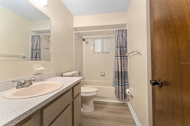10012 SW 88th Ct, Ocala, FL 34481 - full bathroom featuring toilet, wood finished floors, vanity, shower / tub combo with curtain, and a textured ceiling