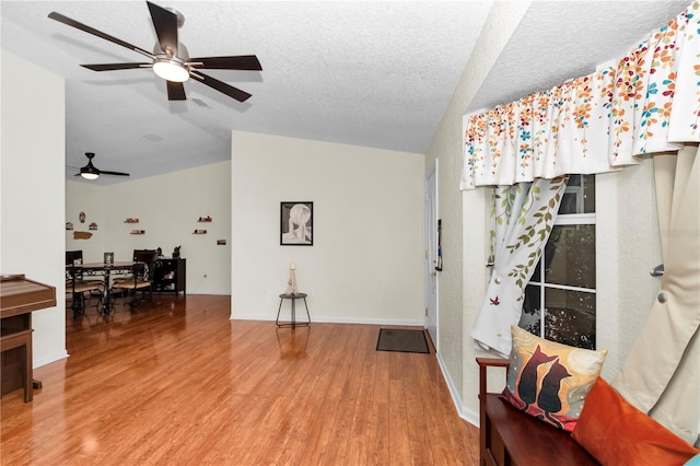 10806 SW 86th Ave, Ocala, FL 34481 - entryway with ceiling fan, lofted ceiling, wood finished floors, and a textured ceiling