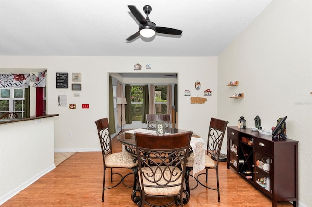 10806 SW 86th Ave, Ocala, FL 34481 - dining space with light wood-type flooring, ceiling fan, and baseboards