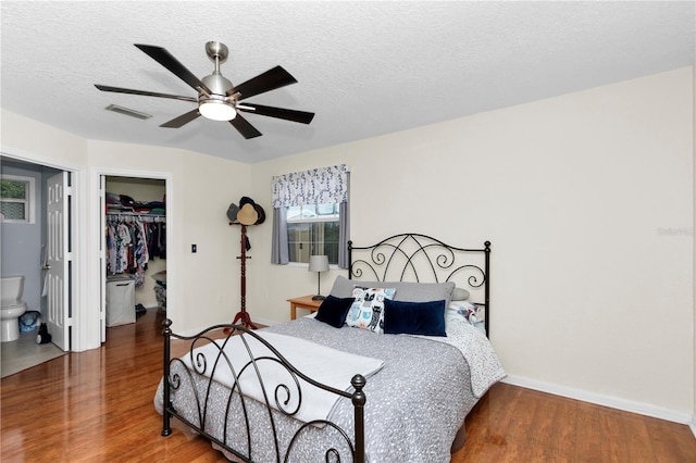 10806 SW 86th Ave, Ocala, FL 34481 - bedroom with wood finished floors, a spacious closet, a closet, baseboards, and ceiling fan