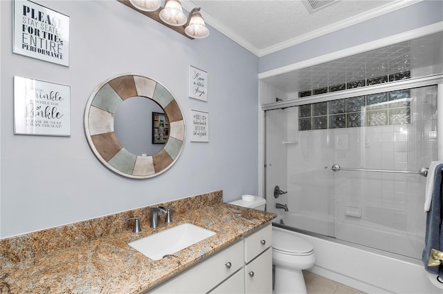 10806 SW 86th Ave, Ocala, FL 34481 - bathroom with toilet, vanity, combined bath / shower with glass door, crown molding, and tile patterned flooring