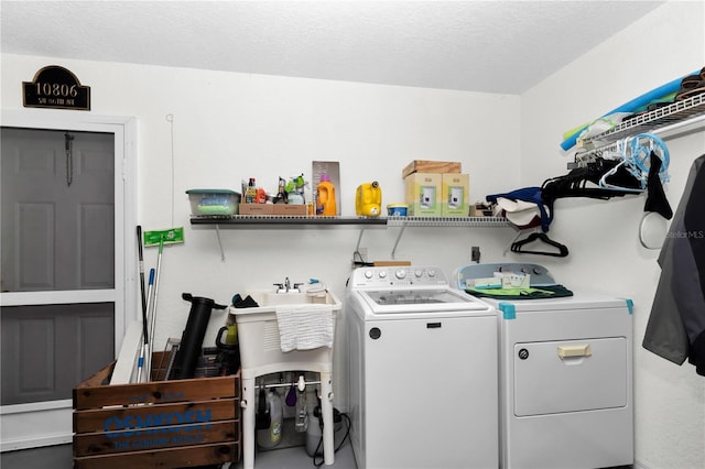 10806 SW 86th Ave, Ocala, FL 34481 - laundry room with washer and dryer and a textured ceiling
