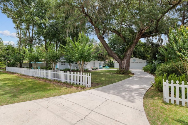 12335 SE 130th Ct, Ocklawaha, FL 32179 - obstructed view of property with a detached garage