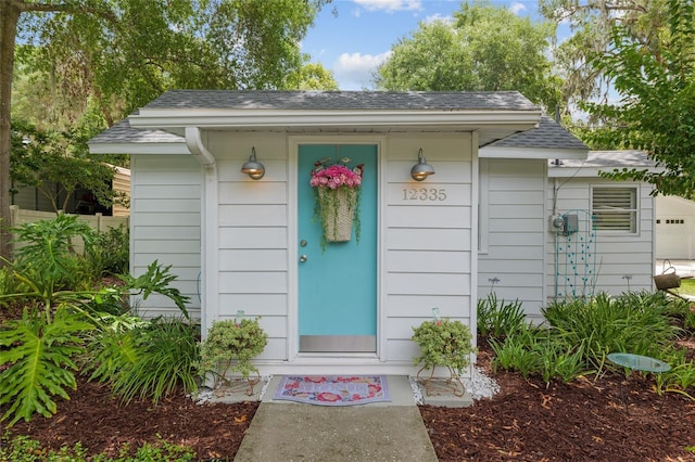 12335 SE 130th Ct, Ocklawaha, FL 32179 - property entrance featuring roof with shingles