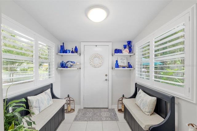 12335 SE 130th Ct, Ocklawaha, FL 32179 - foyer entrance with light tile patterned flooring, plenty of natural light, and baseboards