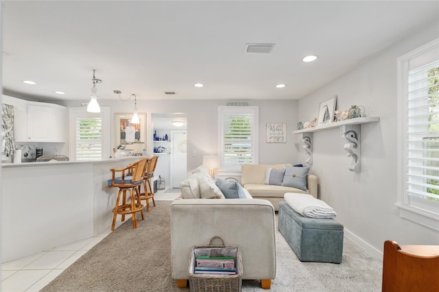 12335 SE 130th Ct, Ocklawaha, FL 32179 - living room with plenty of natural light, recessed lighting, and light tile patterned floors