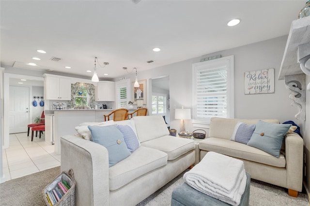 12335 SE 130th Ct, Ocklawaha, FL 32179 - living room with recessed lighting, light tile patterned flooring, and light carpet