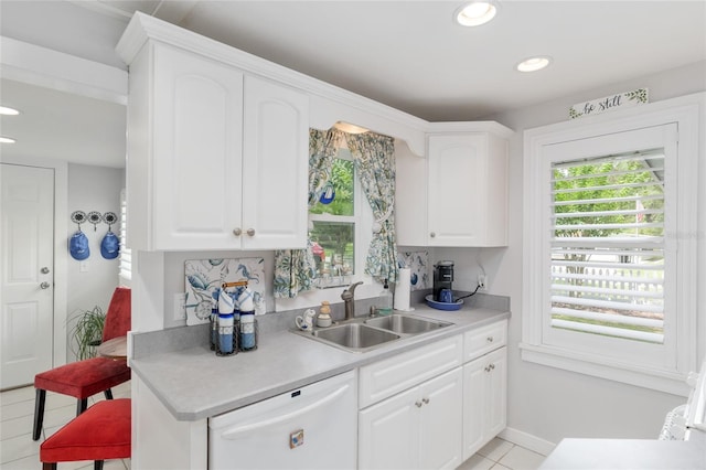 12335 SE 130th Ct, Ocklawaha, FL 32179 - kitchen with dishwasher, a sink, light countertops, light tile patterned flooring, and recessed lighting