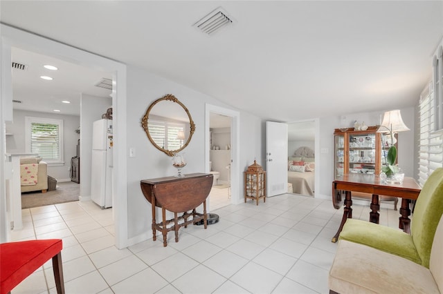 12335 SE 130th Ct, Ocklawaha, FL 32179 - living room with light tile patterned floors, recessed lighting, and baseboards