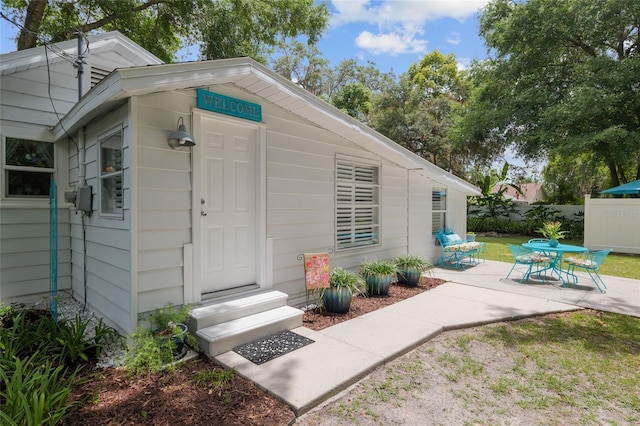 12335 SE 130th Ct, Ocklawaha, FL 32179 - view of exterior entry with a patio area
